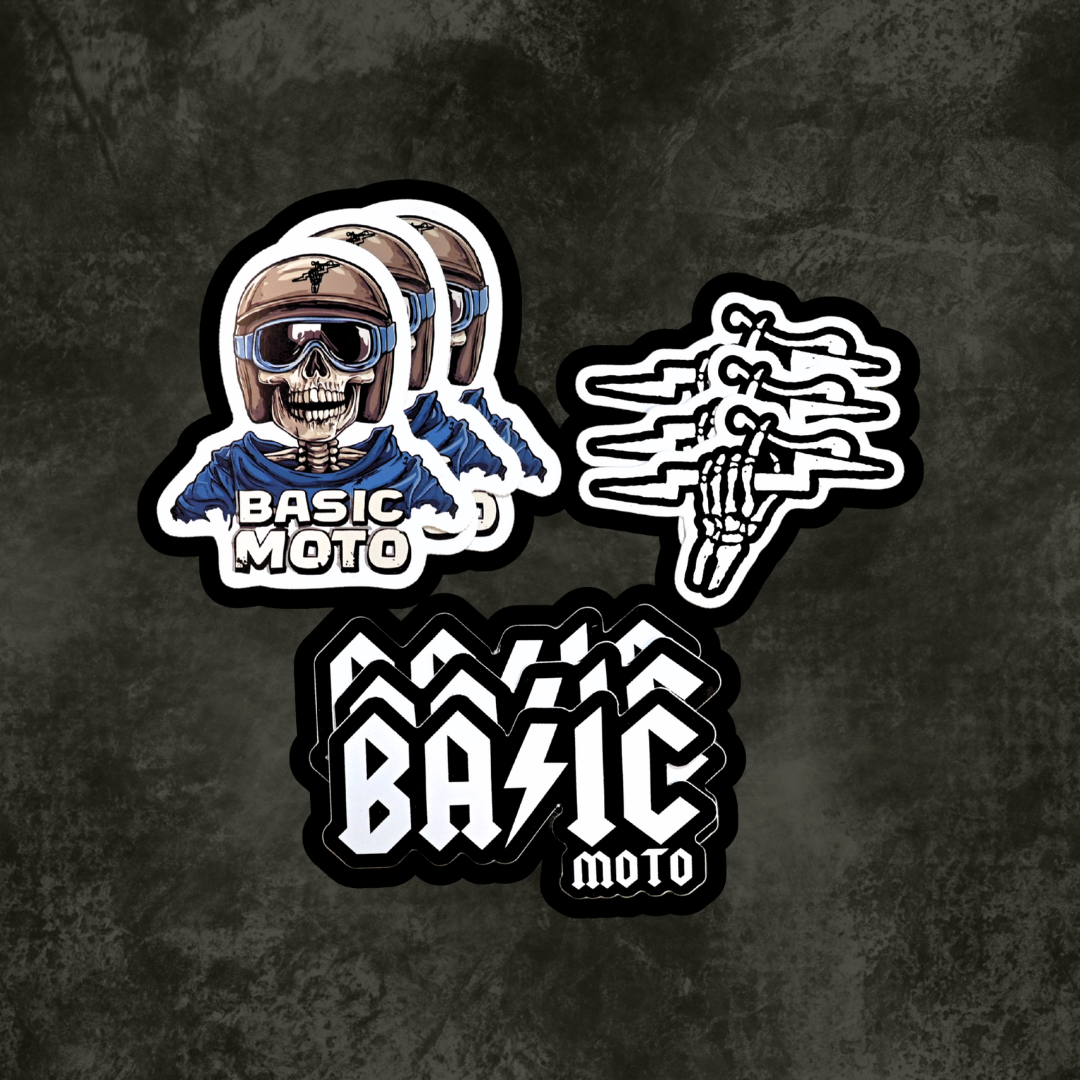 Nine 'Basic Moto' stickers on a dark textured background