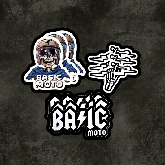 Nine 'Basic Moto' stickers on a dark textured background