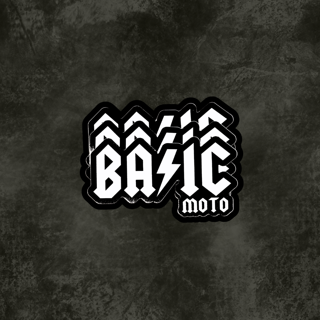 Black and white 'Basic Moto' logo on a textured black background